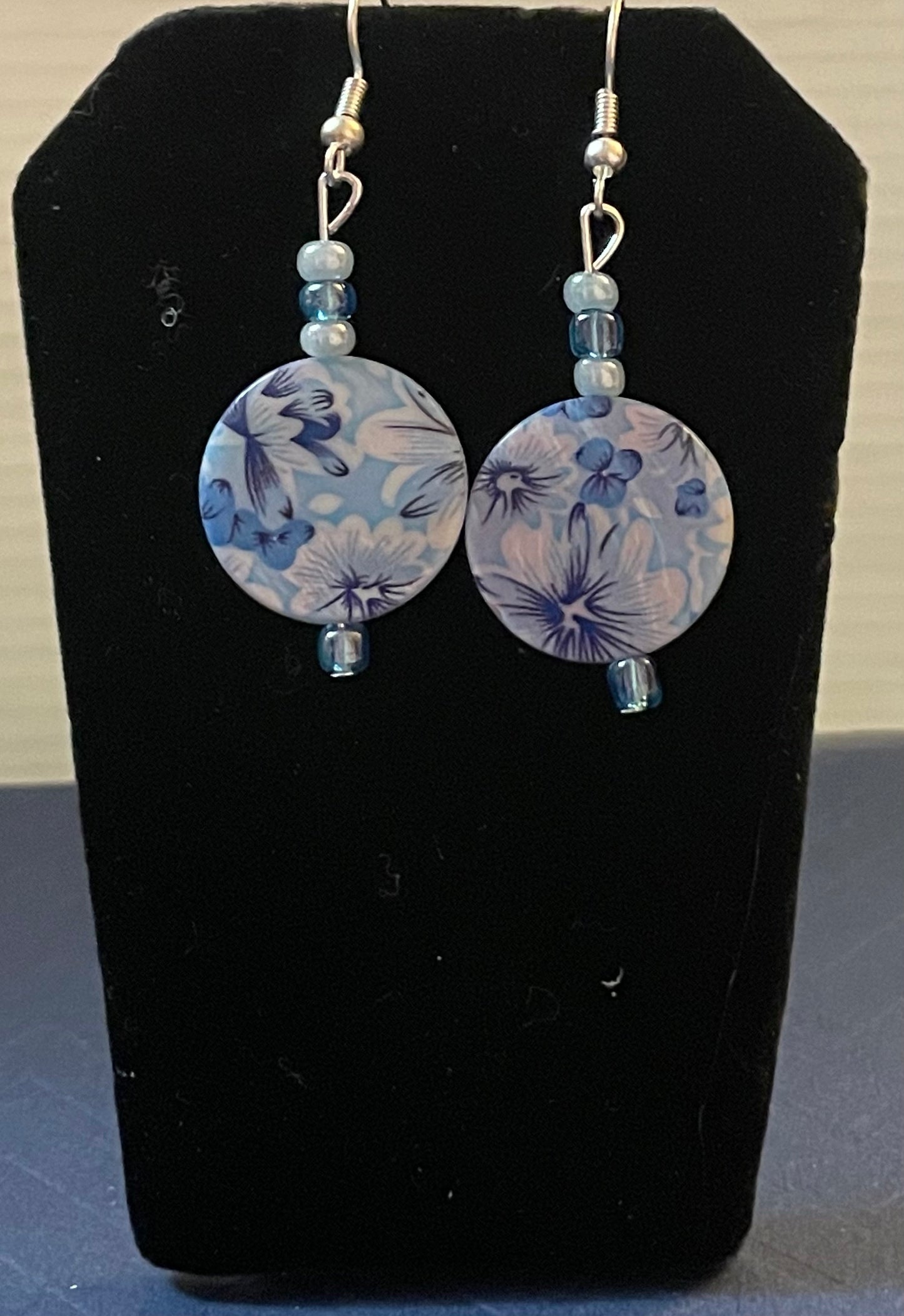 Swirling flowers in blue earrings