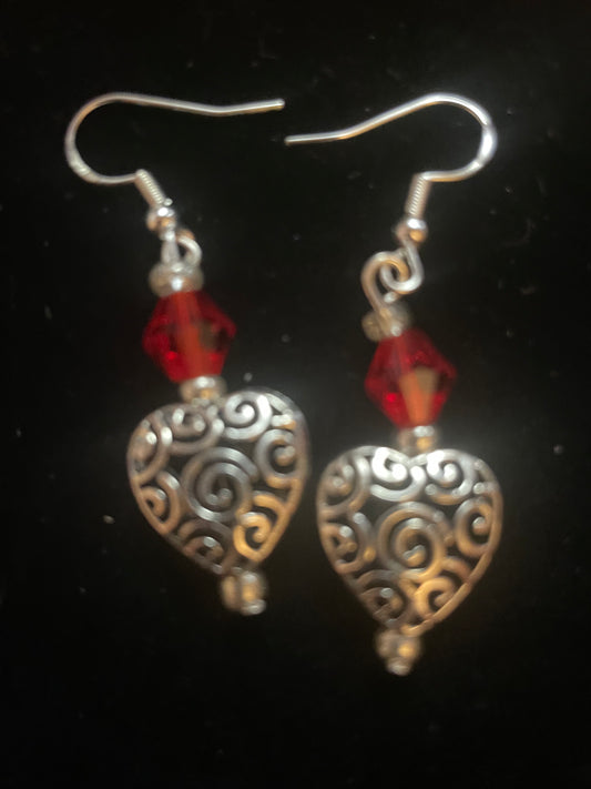 Small silver toned scrollwork heart earrings